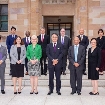 Participants in the signing ceremony on the steps of UQ's Forgan Smith building